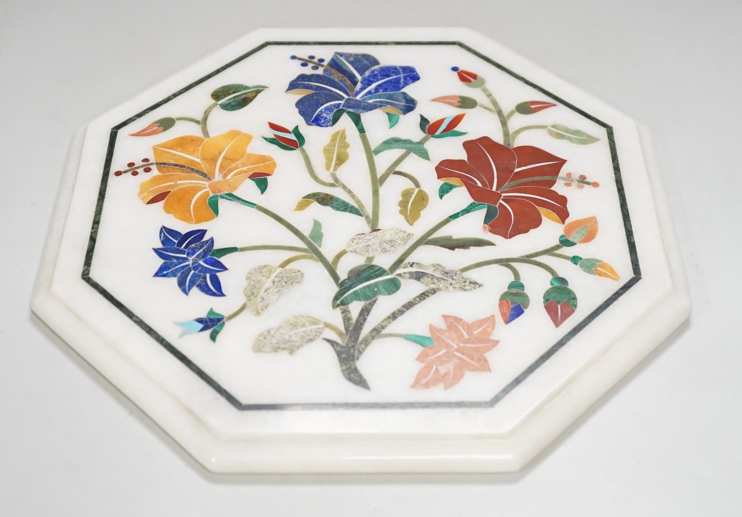 An Agra hardstone inlaid table top. 30cm wide